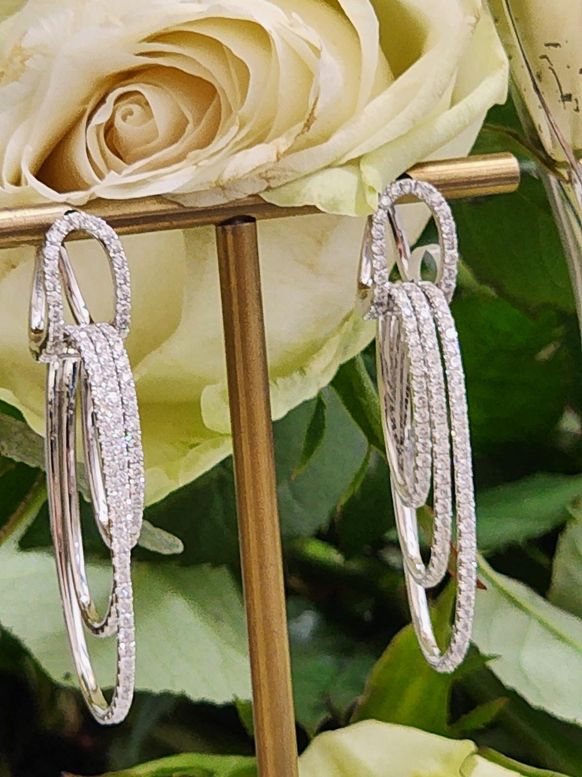 White gold drop earrings with diamond links