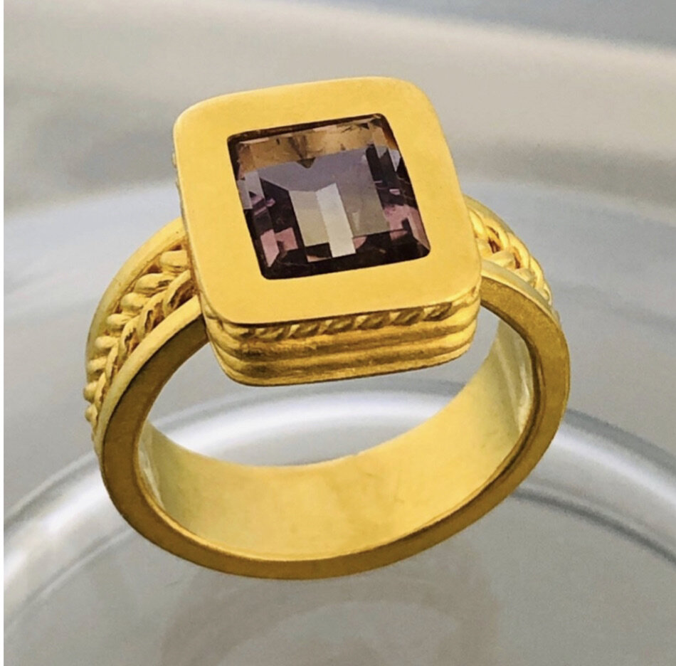 Gold ring with square amethyst