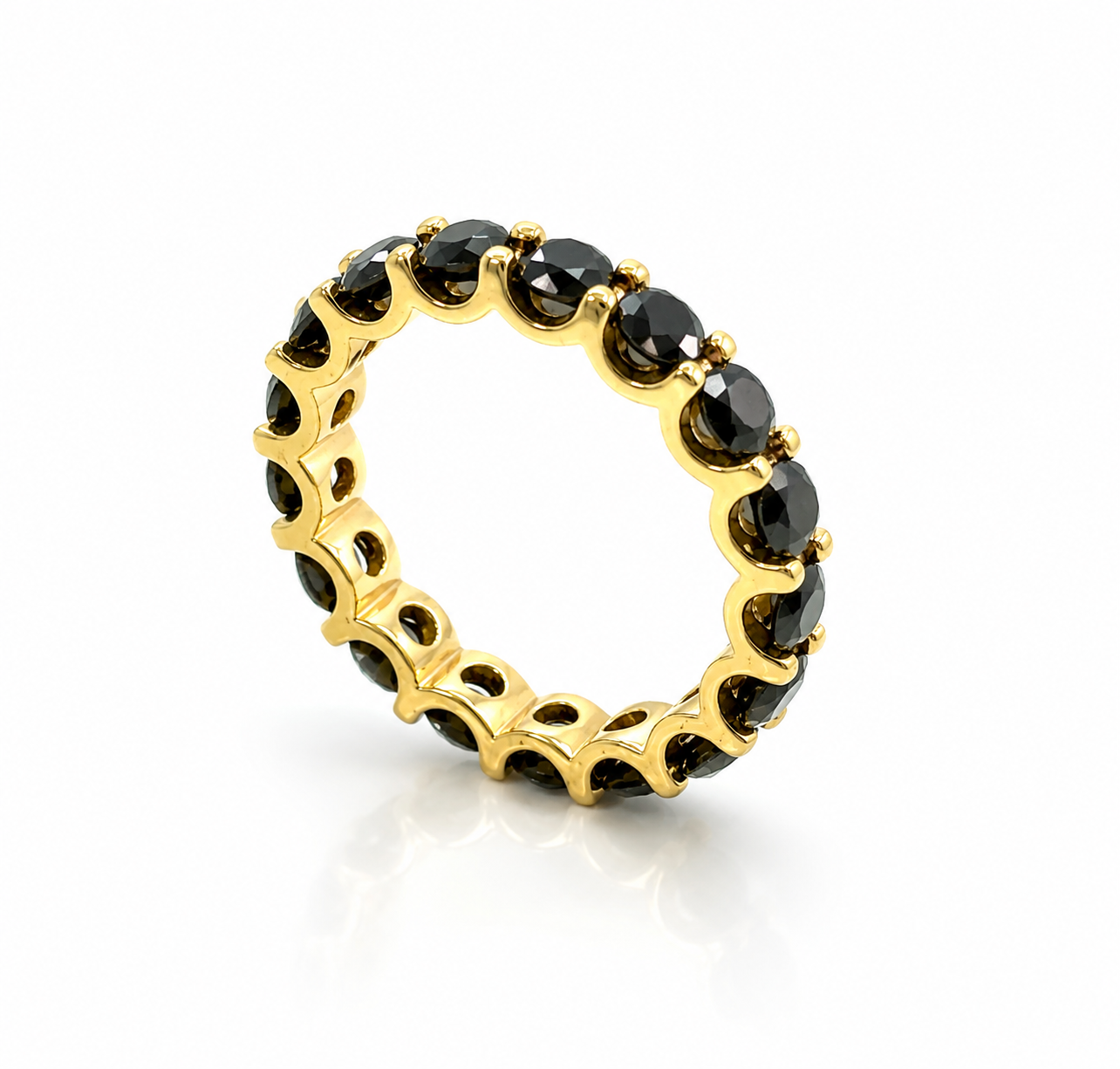 Yellow gold eternity ring with black diamonds