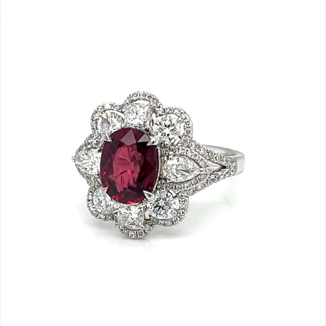 White gold ring with oval ruby and diamonds